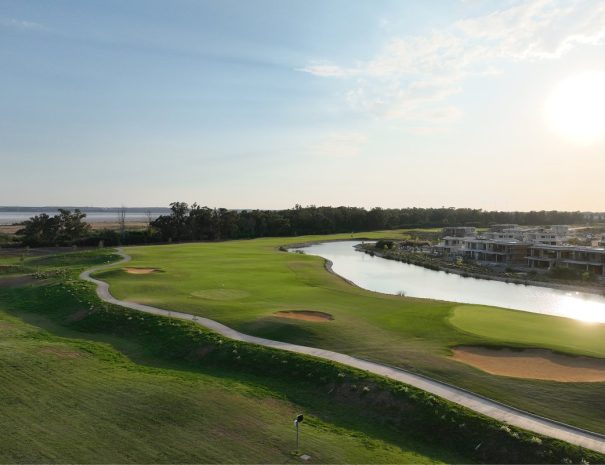 Limassol Greens aerial view of fairway, lake and resort villas
