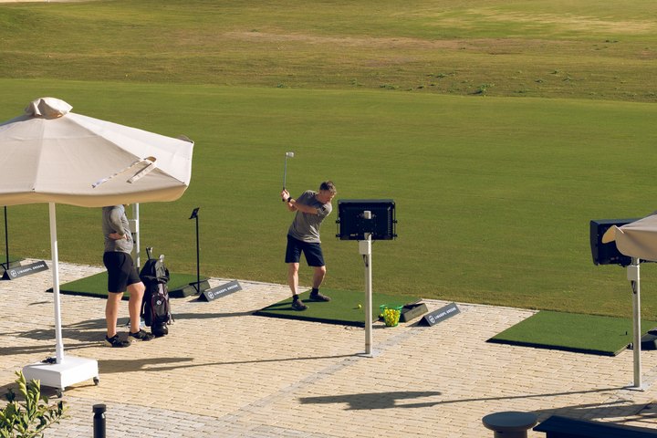 Golfer practising at the Limassol Greens driving range