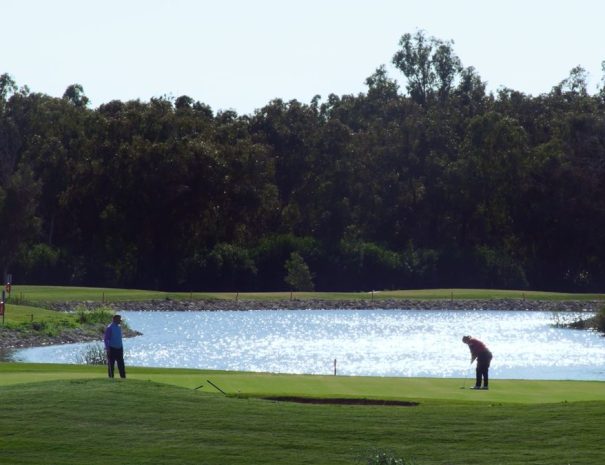 Limassol Greens putting green by the lake